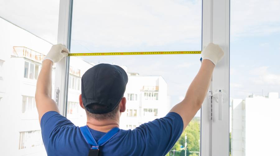 glazier near me measuring glass for Brisbane window replacement