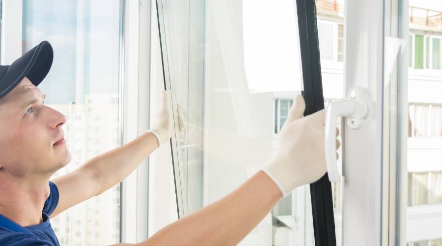professional glazier near me installing window glass Brisbane home