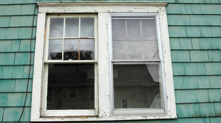 common Springwood glass problems showing older windows storm damage and security upgrade examples