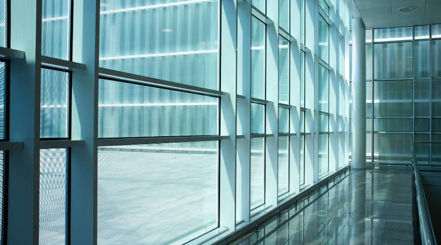 commercial glass types comparison showing laminated toughened and double glazed options for different business needs