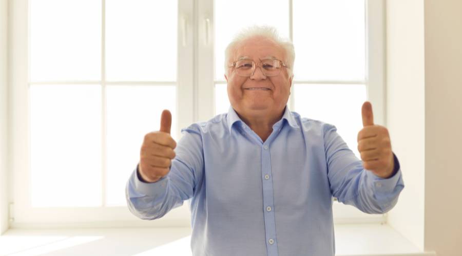 happy Capalaba customer with local glazier after professional glass replacement using marine grade coastal materials